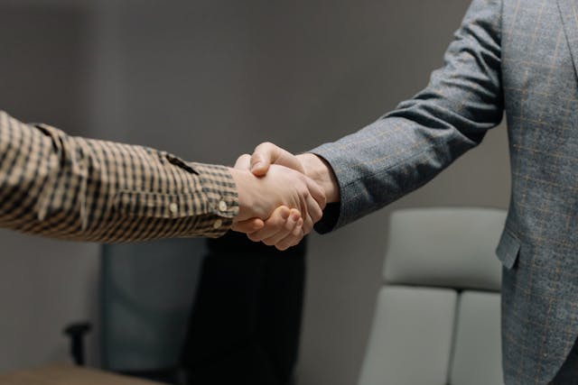 Handshaking to confirm a business partnership