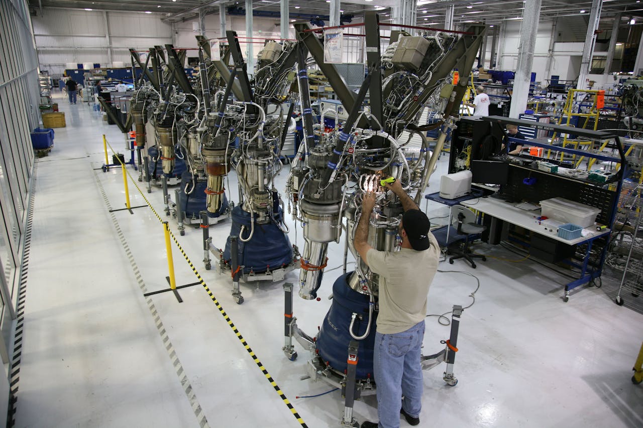 A man working with machinery on a factory floor