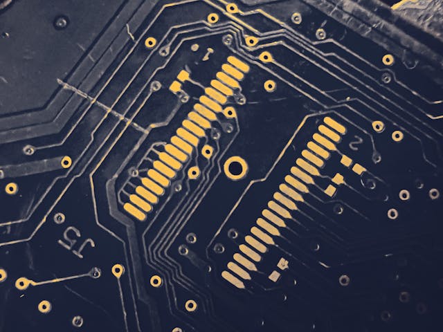 A close-up photo of a chip on a PCB inside a computer.