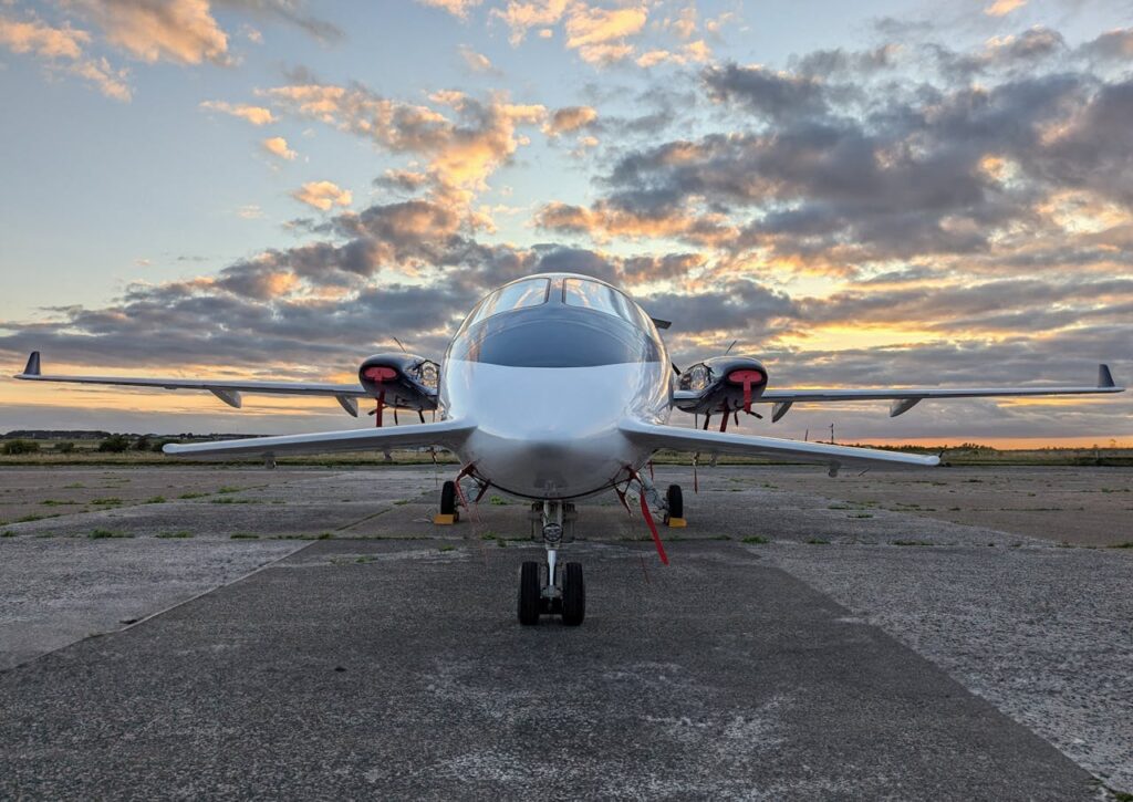 Modern jet plane parked at an airport.